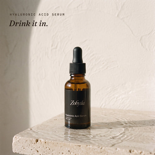 Zobyda Hyaluronic Acid Serum 30ml bottle on wet travertine stone