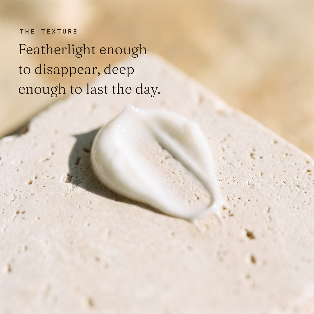 Close texture of Zobyda Oil-Free Daily Moisturizer cream on pale stone