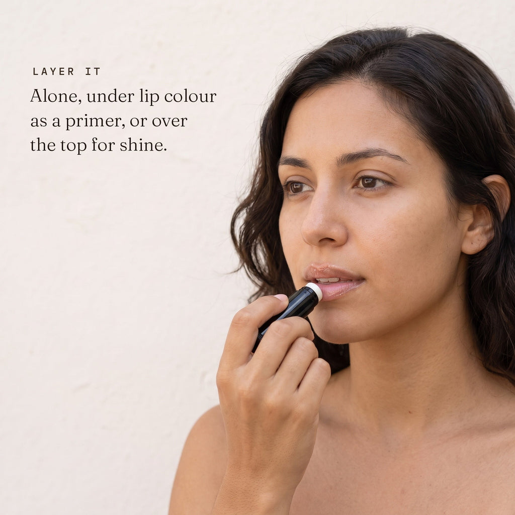 Woman applying Zobyda Vegan Lip Balm, worn alone or under lip colour
